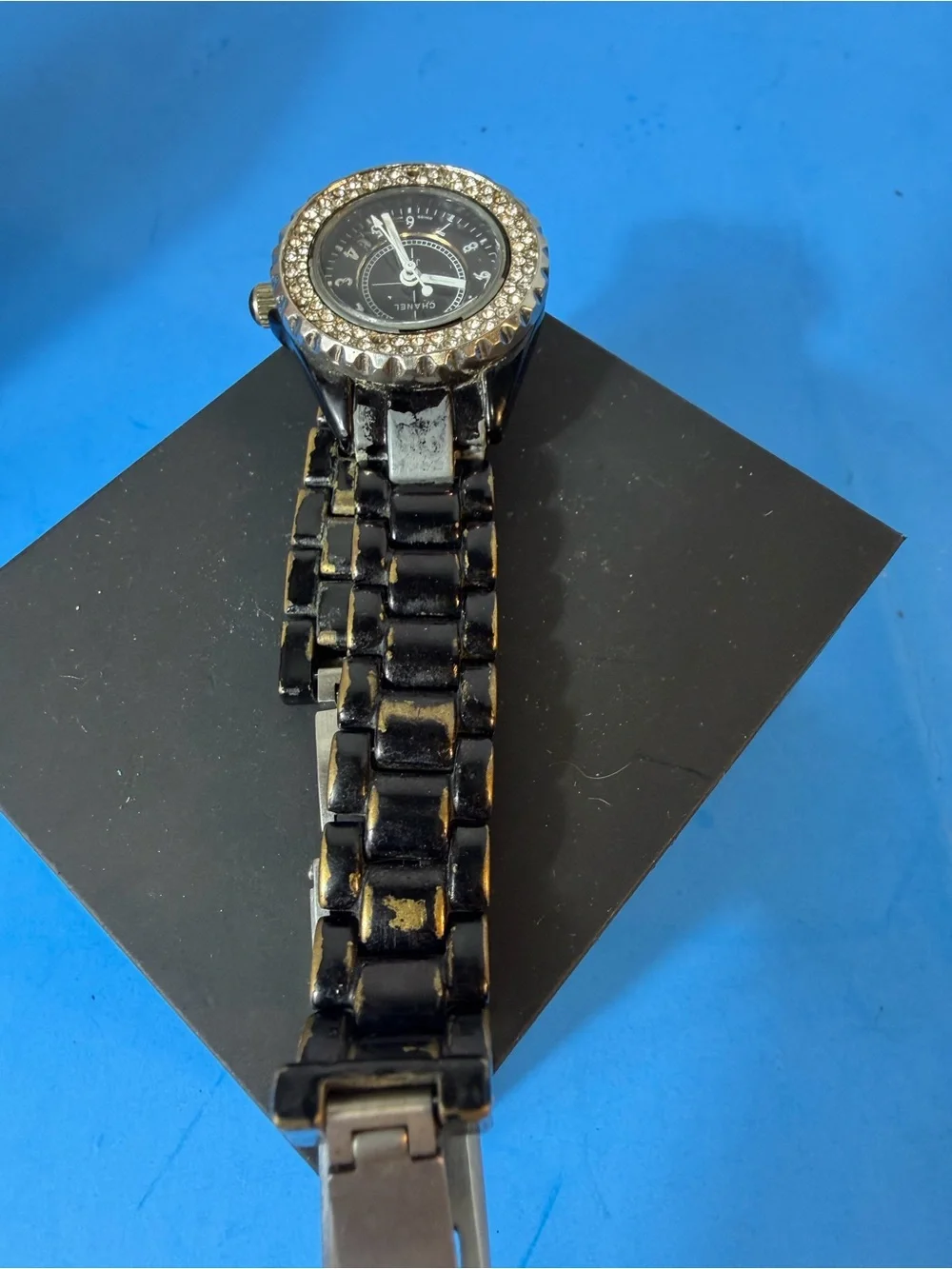 Chanel J12 women's wristwatch with a black ceramic case and bracelet and a bezel